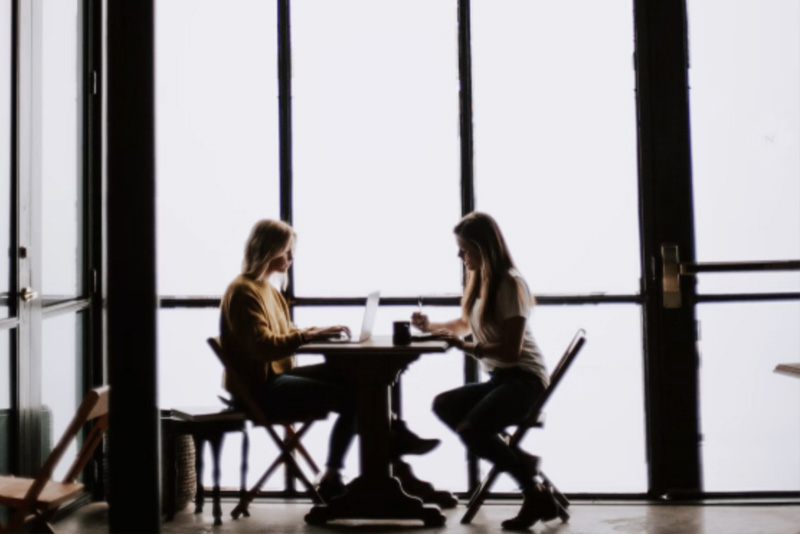 Photo of two women having a meeting